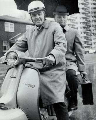 Max Bacon, in helmet, and John Bousfield bring backgrounds of English and U.S. training to the Toronto planning scene.