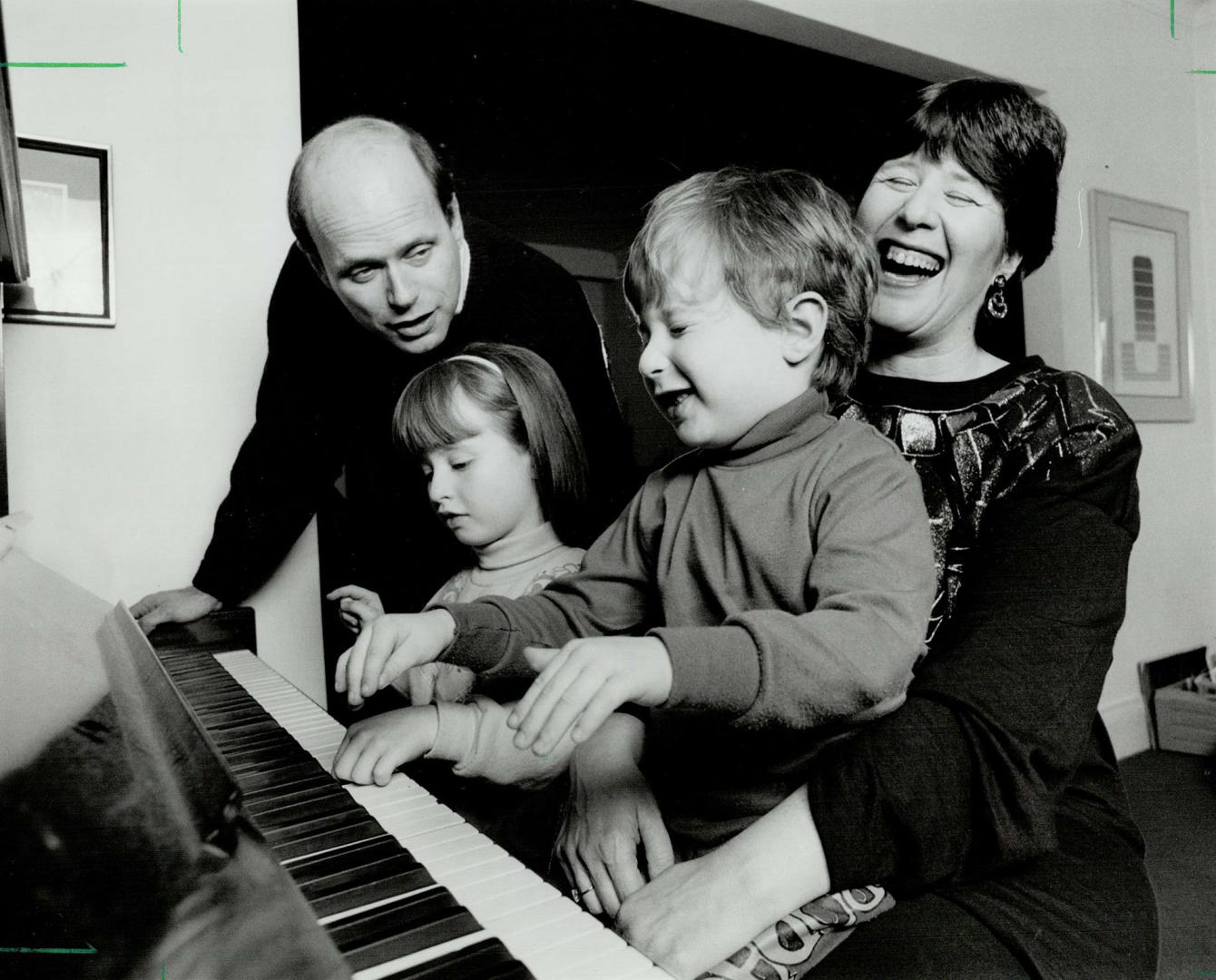 Family time: Christmas is just another holiday to enjoy together for the Jewish family of Richard Banks, Debbie Sherman and children Elizabeth, 6, and Ira, 4.