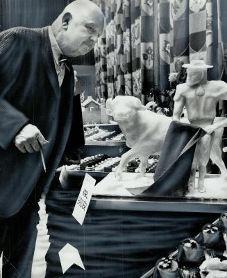 James Beard, internationally known American culinary authority judges a display in the Culinary Arts Festival, part of the Food Service and Hospitality show. It took 37 judges to consider displays in the show which closes today.