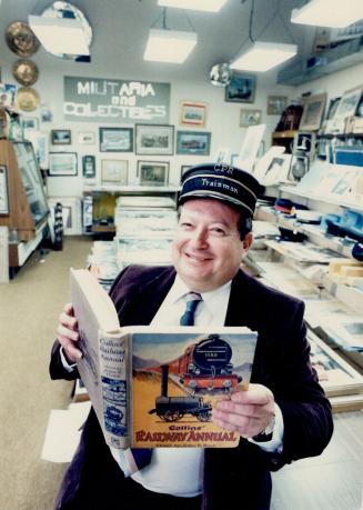 Collectors' shop: Larry Becker, owner of Larry Becker's Collectibles Warehouse on Limestone Crescent in North York, shows some of his railroad memorabilia. His inventory includes military and transportation-related artifacts, post cards, coins, newspapers, sheet music and magazines.