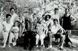 Burgeoing clan: Tuck and Marion Berry, centre, head an extended family in Shelburne that livesin harmony - You learn to sit and listen, Marion explains and wonders why quarrelsome Canada can't follow suit.