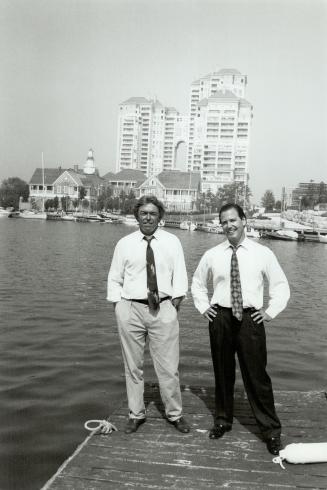 Developers Larry Boland, left and Richard Weldon meet summer day campers on the boardwalk.