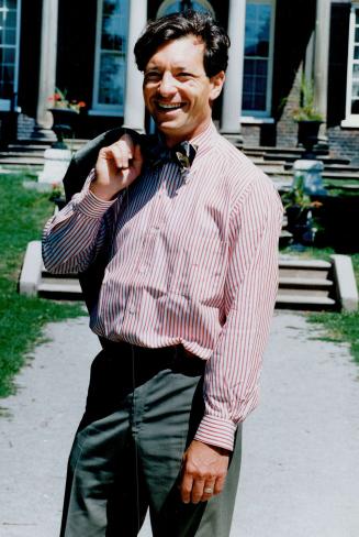 Above: Henry Brenzel, president of The Atlas Group, is polished in poplin suit from New York's Brooks Brothers and bow tie.