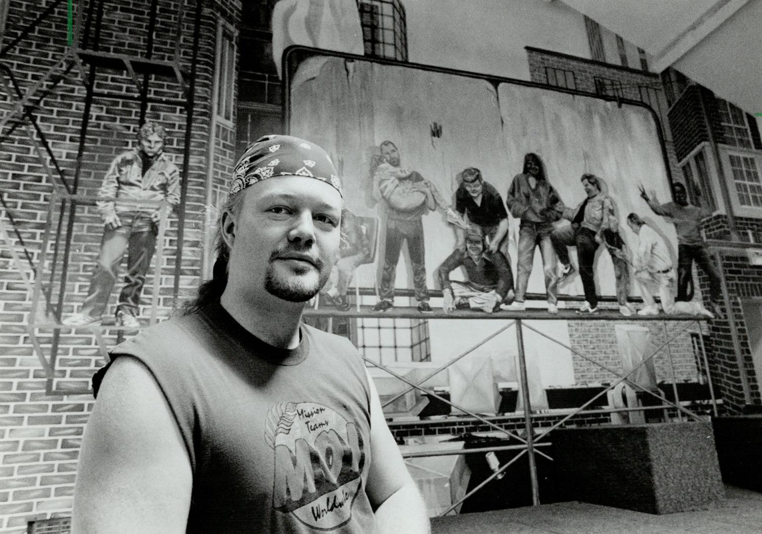 Bright Future: Mission counsellor Rob Bright, 26, a former street kid, stands before a mural and stage where Christian rock bands perform for homeless teens at the Evergreen Drop in Centre on Yonge St.