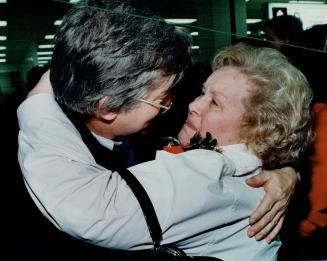 Dream comes true: Sjoerd (Johny) Bruggenkamp of the Netherlands and his stepmother Marion Cates embrace yesterday at Pearson International Airport as they met for the first time.