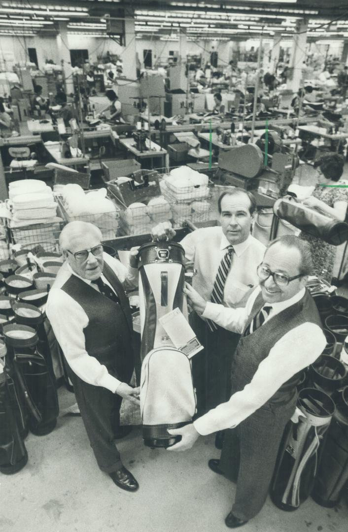 For the links: Cooper Canada chairman Jack Cooper, left, vice-chairman John Cooper, centre, and president Henry Nolting display a golf bag.