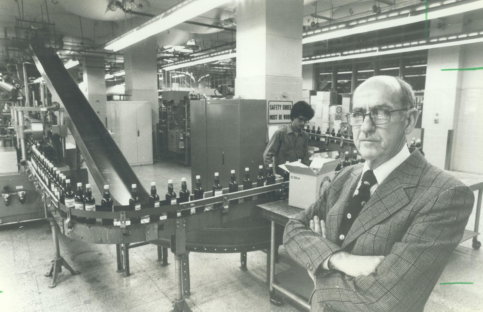 Where the action is: Jack Couillard, the LCBO's assistant general manager in charge of stock purchasing and product control in front of the bottling line in the plant at Lake Shore Blvd. East and Freeland St. The LCBO ensures drinkers that the alcohol they consume has been scientifically tested and produced in quality-controlled conditions.[Incomplete]