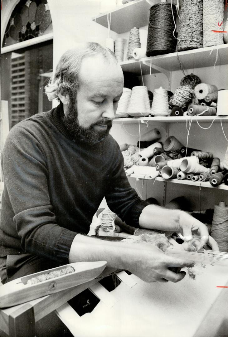 Weaver Robert Cawood is at work at his loom in his shop The Village Weaver, at Church and Moneith Sts. The craftsman, who learned his skills in his native Yorkshire, England, has been teaching. Metro residents the crafts of spinning and weaving for 10 years. Classes run one night a week for three months.