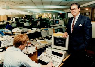 Profiting from patience: Jeffrey Chisholm, right, executive vice-president and treasurer for the Bank of Montreal, took over the bank's treasury operations in April. Trader Alex Jurshevski, left, has information at his fingertips. Chisholm says the bank's traders are skilled at figuring out what's important.