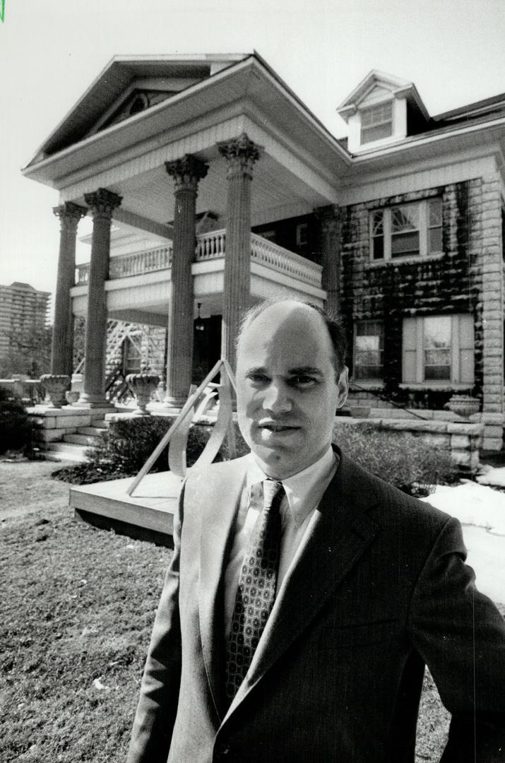 Fighting plan: Toby Condiffe, president of the Moore Park Residents' Association, stands in front of the inglewood Dr. home that owners Fay and Jules Loeb want to turn into an art gallery for the University of Toronto. Residents say they want people, not paintings, next door to them.