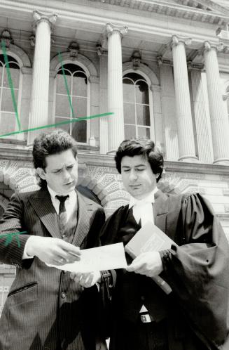 Angry over strike: Ken Connors consults with his lawyer Luis Douramakos outside Osgoode Hall yesterday. Connors is seeking an injunction to force Ontario's doctors back to work.