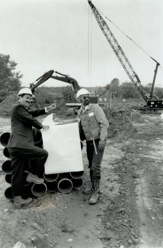 On the job: Kaitlin Group president Bill Daniel, right, talks shop with engineer John Oliver.