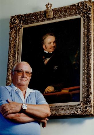 Royal link: Charles de Bourbon stands in front of a portrait of his great-great grandfather, who claimed to be Louis XVII of France.