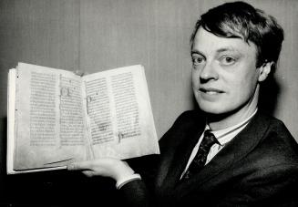 Great detective: Christopher de Hamel, here with a 13th-century manuscript from U of T's Thomas Fisher Rare Book Library, revealed private collection of Baron de Rothschild.