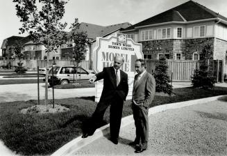 New trend: Developer Fred DeGasperis, left, and builder Tony Gulietti, outside the quattroplexes at Springdale.