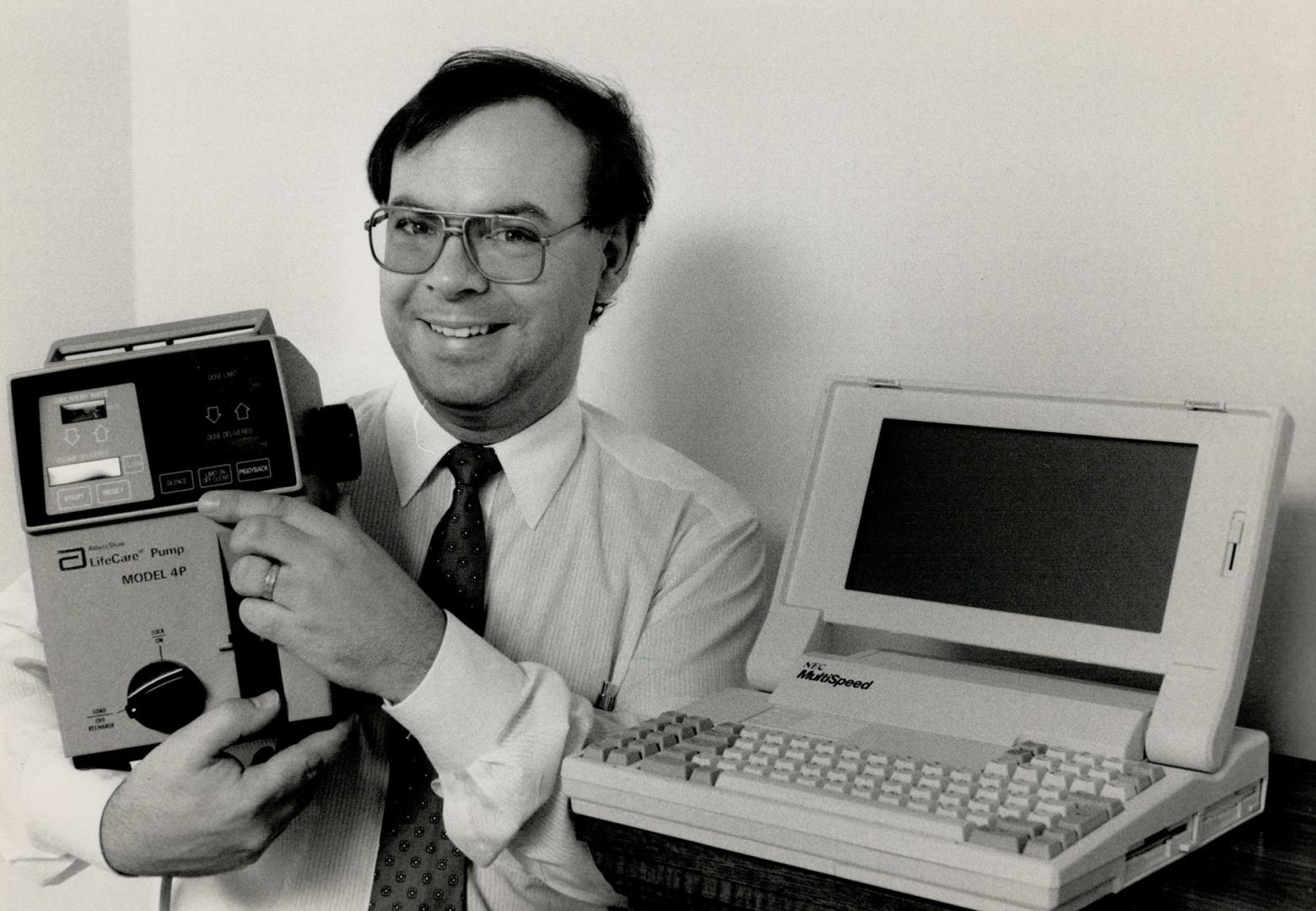 Better Medicine: Dr. John Doyle is using this NEC portable computer along with the Abbott Laboratories infusion pump to develop a better system of dispensing drug mixtures to seriously ill patients. The work combines his engineering degree with his traini