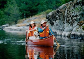 Dipping Duo: Tim and Kathy Dyer, and Sara, enjoy an outing at their White Squall paddling centre, north of Nobel, near Parry Sound.