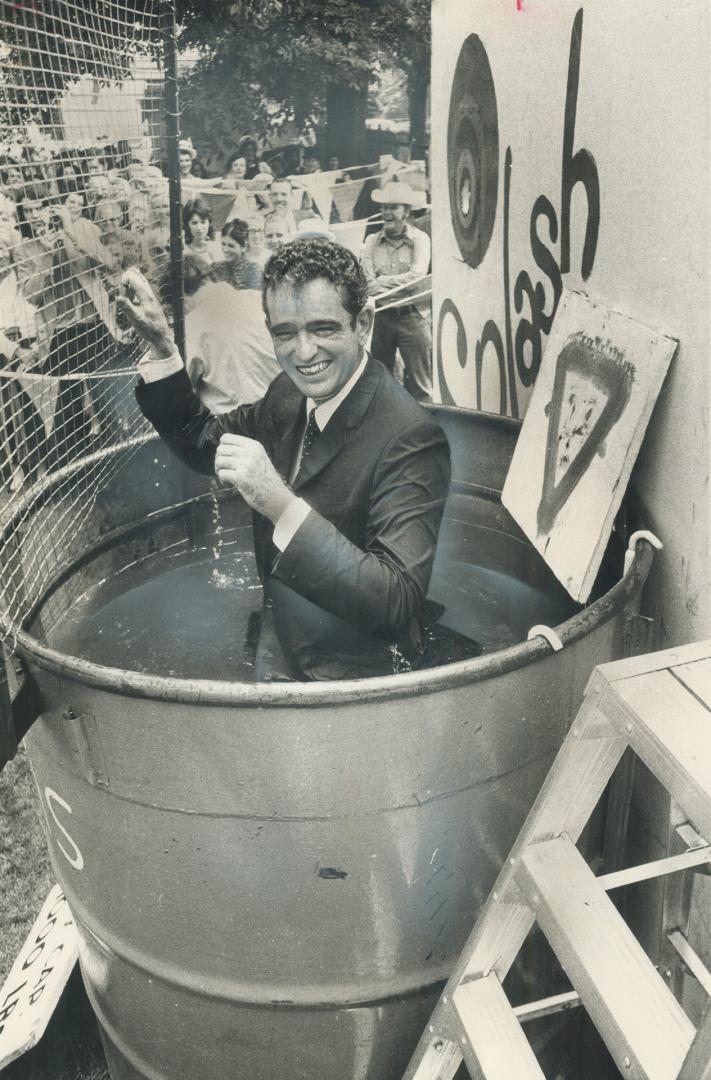 Hit the mark -- and Dunk a veep. Gordon Fleming, financial vice president of Canada Life Assurance, was the victim when this executive dunk went into action at the company's three-day celebration of its 125th anniversary, on the north lawn of the head off