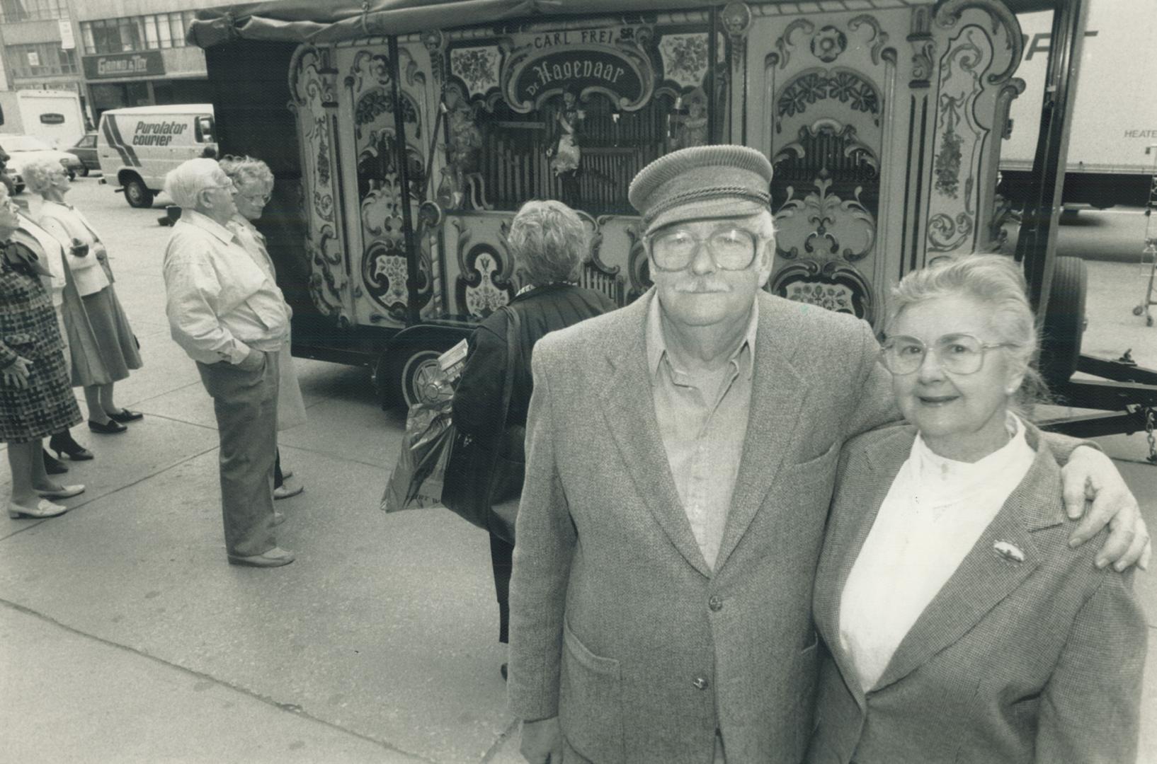 Prized possession: Franklin Foley, 65, and wife, Dorothy, 62, of Belleville, stand with Foley's Dutch concert street organ that he has lovingly restored. The couple recently played the organ at Yonge and Bloor Sts for a special promotion on Holland by The