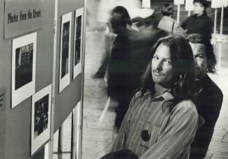 Show of their own: Larry Fairbairn, 34, foreground, and Mike Crawford, 37, have contributed to the Photos from the Street exhibit at Toronto City Hall, which opened yesterday and ends Friday.