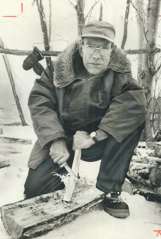 Survival instructor Bill Garrard cuts a feather stick - an easy way to start a fire - during a demonstration of wilderness survival techniques in the Terra Cotta Conservation Area. Three fires 50 yards apart in a triangle is the standrad signal to alert a