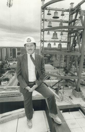 On top of things: Glen Garwood, who's co-ordinating the building of North York's $250 million city centre, stands on the 24th floor. In the background is the centre's computer-controlled carillon, with 14 bells made in Holland. At just 32, Garwood has ris