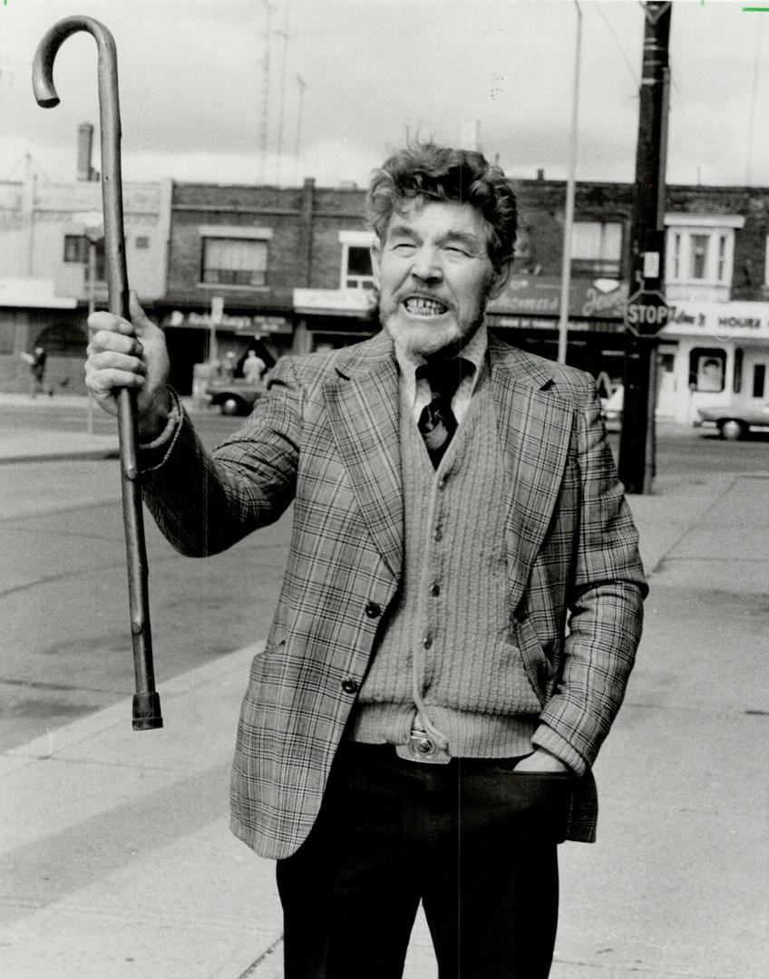 Lonely protest: Herb Field, an organizer of National Distress Day and president of the Canadian Association for Sensible interest Rates holds a lonely protest outside his Danforth Ave. offices. The response to his group's call for a national day of protes