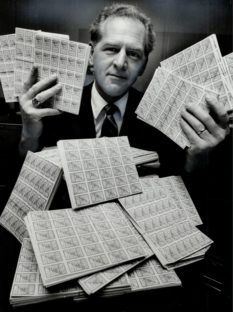 Counterfeit rides: Staff Sgt. Roy Fast with TTC tickets seized during an investigation into what police say was a major ring distributing the tickets in Metro.