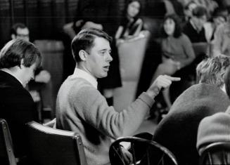 Draft-dodgers should be welcomed into Canada, Tom Faulkner (pointing), president of the University of Toronto students' council, argued in debate yesterday with Edmund Burke Society, opening meet draft-dodger campaign.