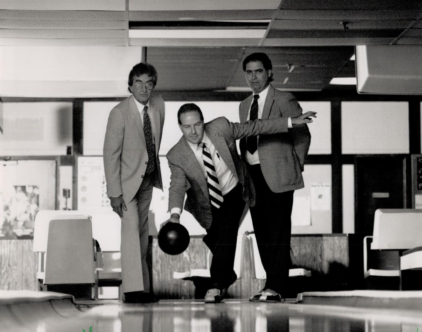 Walter Valentan, left, Harry Fine, centre, and Rob McNaughton, representing the bowling industry, see dire times with new sales tax.