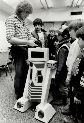 Tick-tock man: Reeb the robot kept Aurora students enthralled as he strutted his stuff recently with the help of owner-creator Doug Fleishman, a student of robotics.