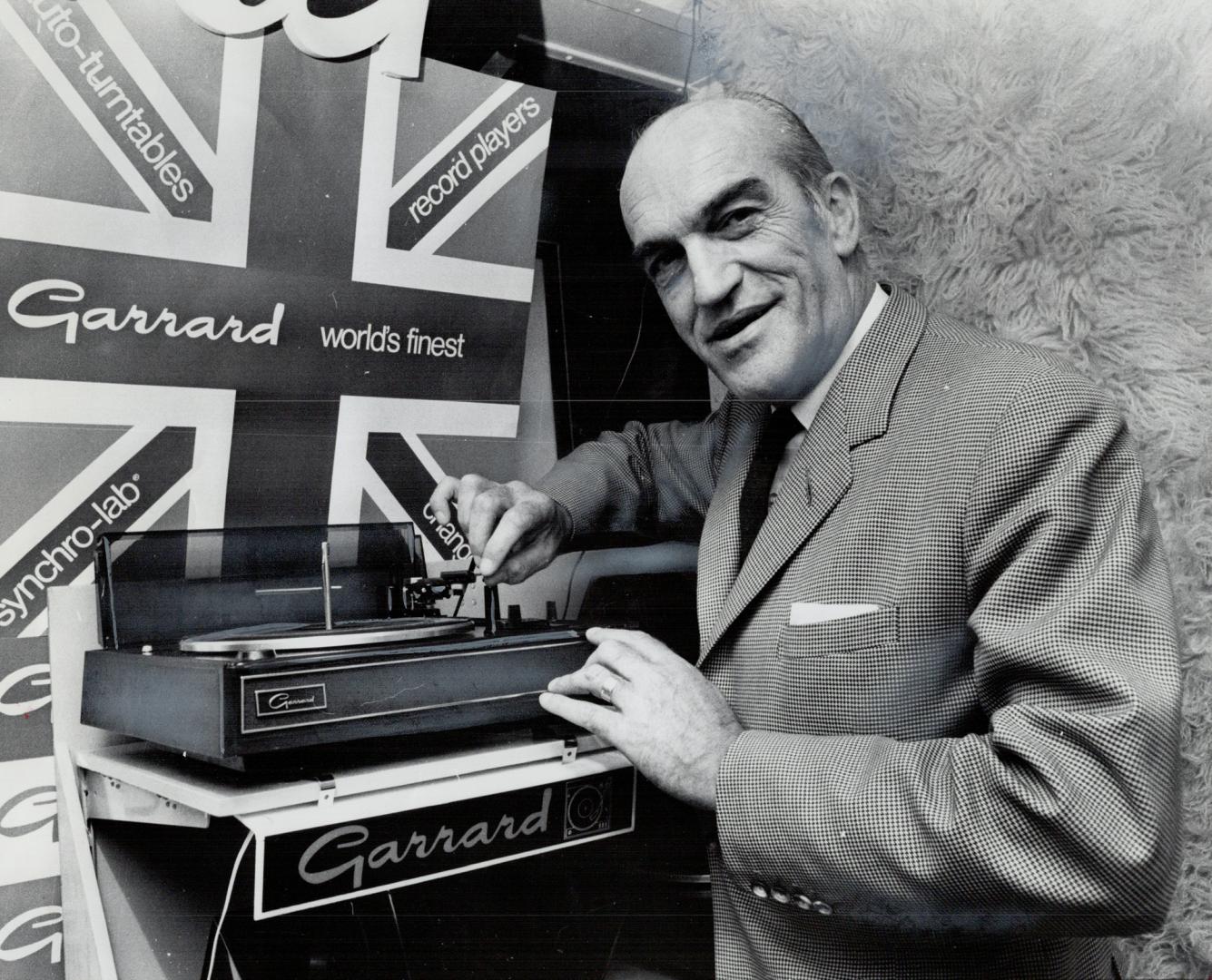 His british factory, just outside London, turns out 60,000 of those Garrard automatic record changers every week. Eighty per cent go for export. Garrard president William Fleming, has hired a train for his latest selling trip in Canada.