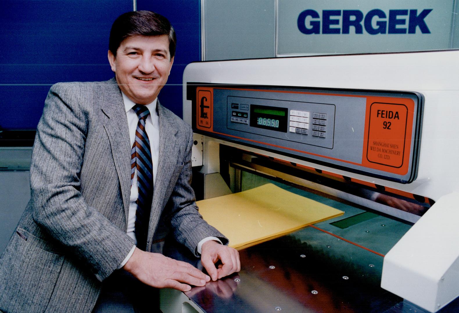 At the controls: Franc Gergek shows off the computerized control panel his Richmond Hill firm made for a Chinese company's paper cutter.