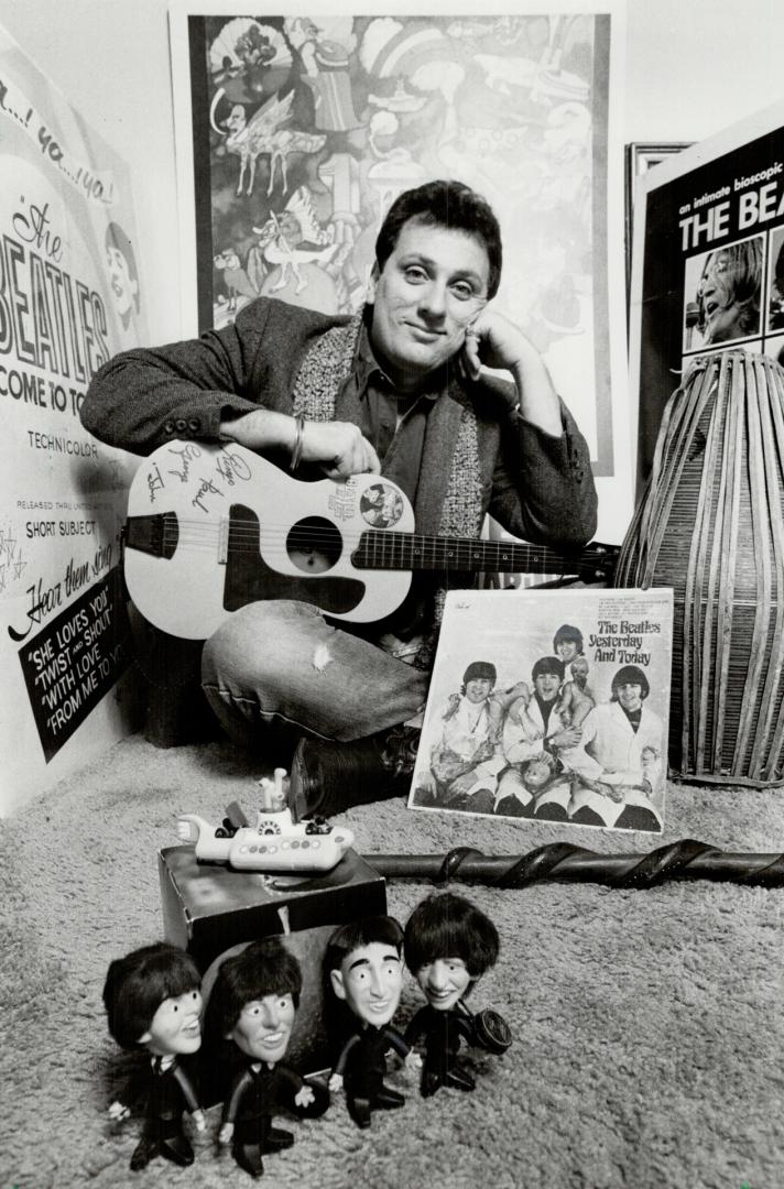 Beatle fan: Geoffrey Giuliano sits in his living room surrounded by Beatle memorabilia