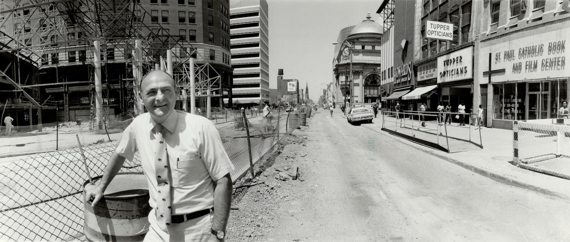 On the move: Buffalo Mayor James Griffin stands on Main St. in front of construction that is part of the new $500-million rapid transit system.