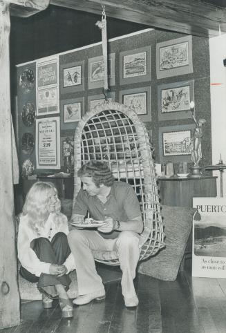 Ann Taylor and Ron Harding chat over plate of food Bachelor Harding was host to the club members, their wives and dates