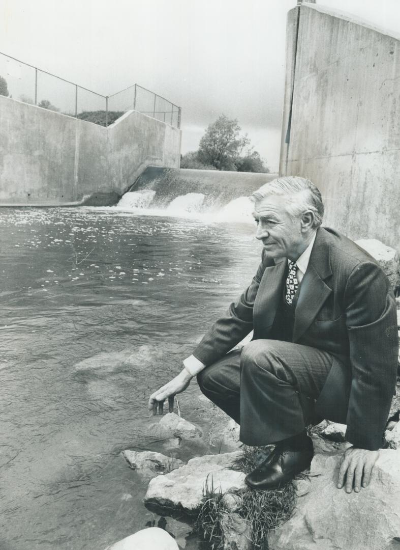 At odds over conversation of Metro ravine land are naturalist Dr. Bruce Cruickshank, left, and Grant Henderson, right, chairman of the Metro Toronto Regional Conservation Authority. We enhance habitat, says Henderson, shown beside a flood control structure at Woodbridge. Cruickshank, shown in ravine land near Metro's Sunnybrook Park, fears Henderson's authority wants to take over and manicure this, too.