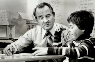 Michael Grapko , the director of University of Toronto 's Institute of Child Study, talks with Andrew Dnieper, 7