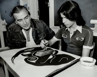 Vern Harper: The founder of Wandering Spirit Survival School (left) helps student Arnold Laford interpret the true colors of his Indian heritage.