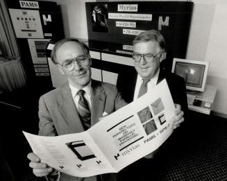 Home-grown silicon: Peter Gregory, Ted White show off Myrias' supercomputer.