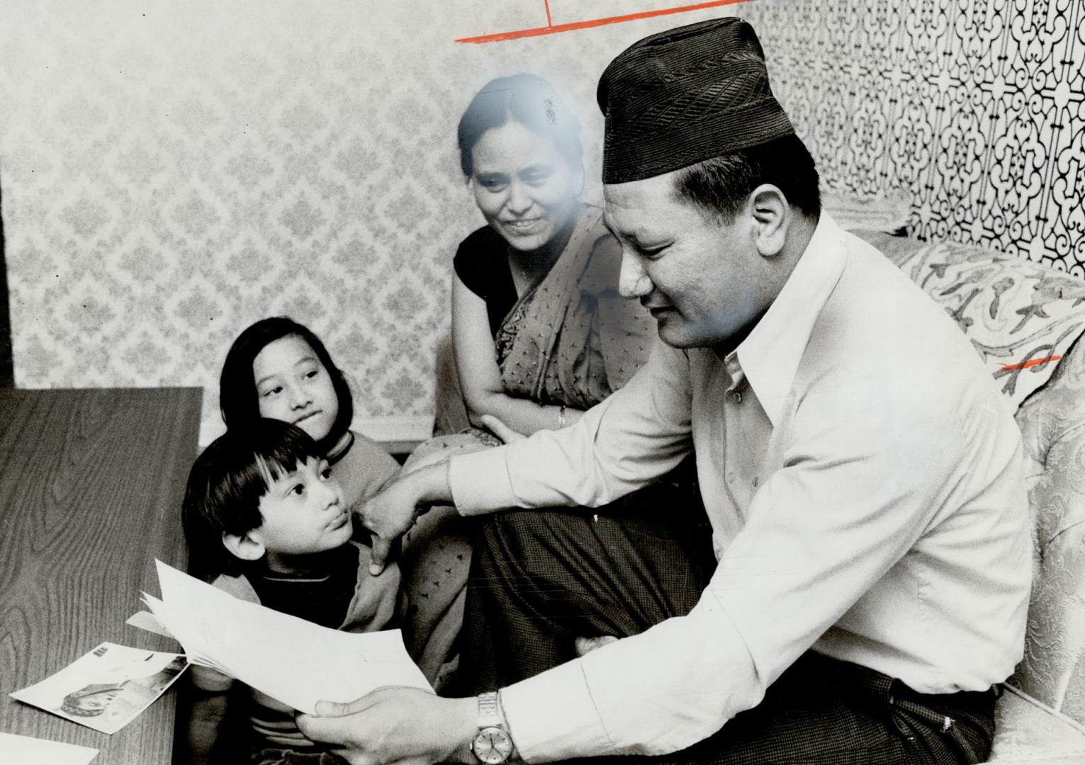 Agincourt Gurkha family of Hari Narain Singh Gurung listens as he reads letter from one of 25 Gurkha soldiers who would like to settle in Canada