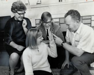 Brains Definitely run in this family. Totalled IQ is 639. Mr. and Mrs. Gordon Haliburton, Gerry, 18, Vicki, 15 are first all-Mensa family.