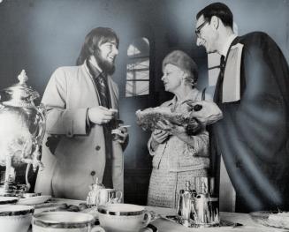 Betty Oram, Centre, Dr. Hallett, Right, at Reception Party followed installation of Dr. Hallett as principal of University College.