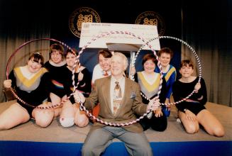 Hooping it up: Frank Hayden celebrates with, from left, Sabrina Prokopiuk, Janette Hargraves, Elly Reeves, Sherry Toporowski, Wanda Jonatchick, Susan Duncan and Bobbilyn Pinkerton