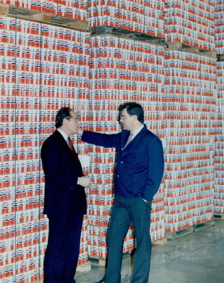 Can chatter: Flemming Heilmann (left) president of Onex Packaging, chats with Whitby plant manager Adrian Roberts