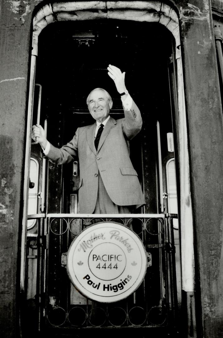 Ultimate train set: Paul Higgins Sr. waves from his rail coach, built in 1924 for CN.