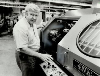 Falling behind: Dean Bob Higgins works a numerically controlled lathe in Humber College's highly advanced technology department.