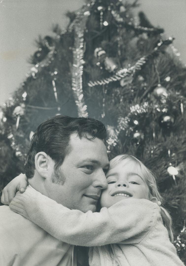 His Christmas gift was a job, and daughter, 6-year-old Patricia, celebrates by hugging John Ingley who had been vainly looking for work for two weeks