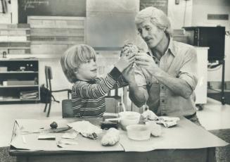 Grandpa Jim Jones joins grandson Bryan, 5, in Island school activity