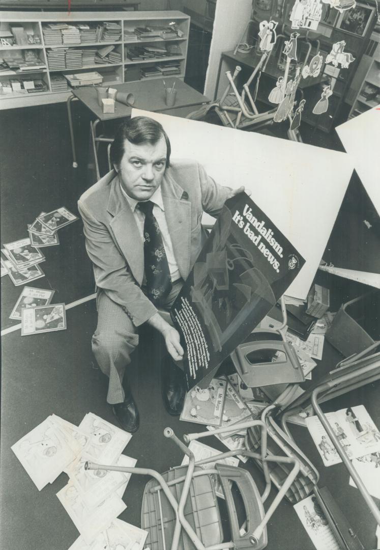 Member of task force investigating vandalism in the City of Mississauga, Jim Kaakee holds a poster designed for the task force to help combat vandals who cost residents $1 million last year